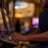 Man Playing Slot Machine